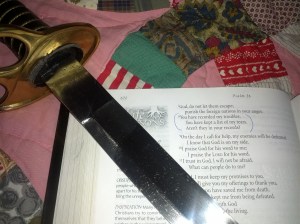 My real Bible and our family sword placed on my grandmother's quilt.