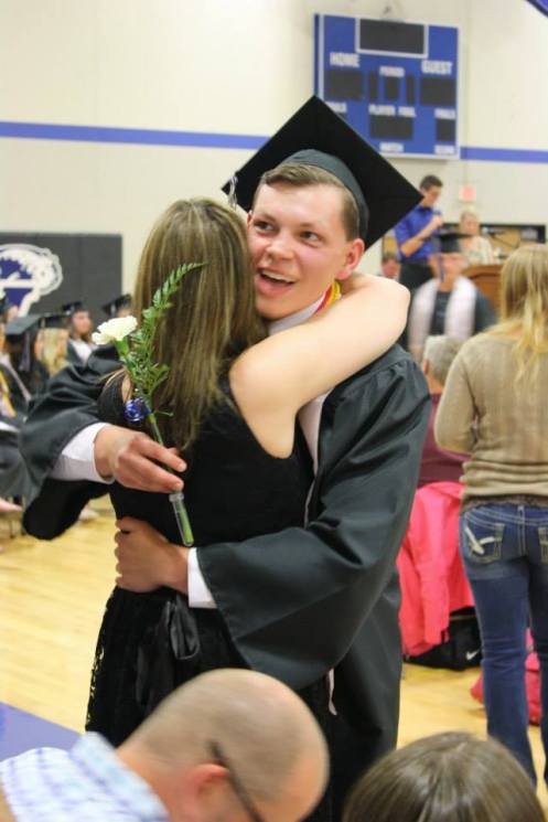 All smiles while giving his teary momma a hug! photo courtesy of his godmother